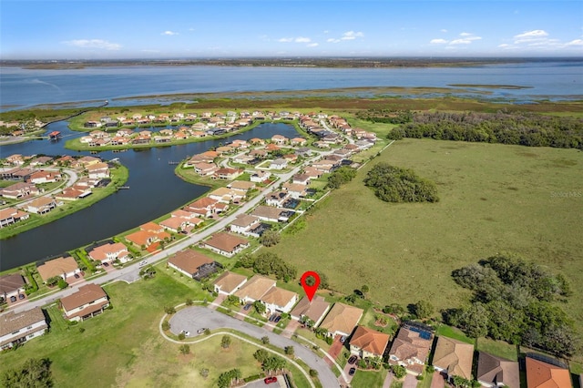 aerial view with a water view and a residential view