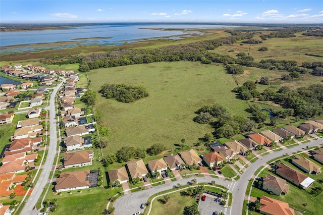 bird's eye view featuring a water view and a residential view