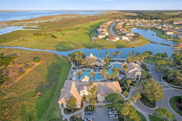 birds eye view of property with a water view and a residential view