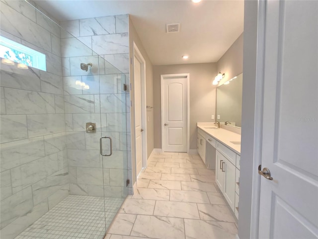 bathroom featuring double vanity, a stall shower, visible vents, marble finish floor, and a sink