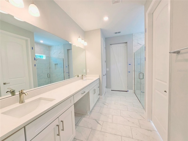 full bathroom featuring marble finish floor, visible vents, a sink, and a stall shower