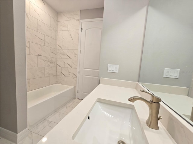 bathroom featuring marble finish floor and vanity