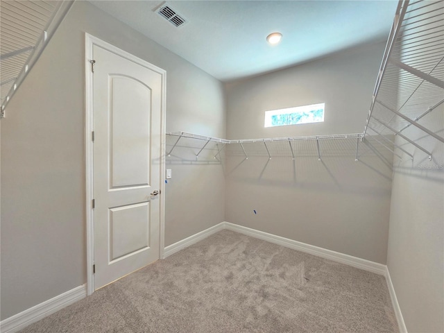 walk in closet with carpet flooring and visible vents