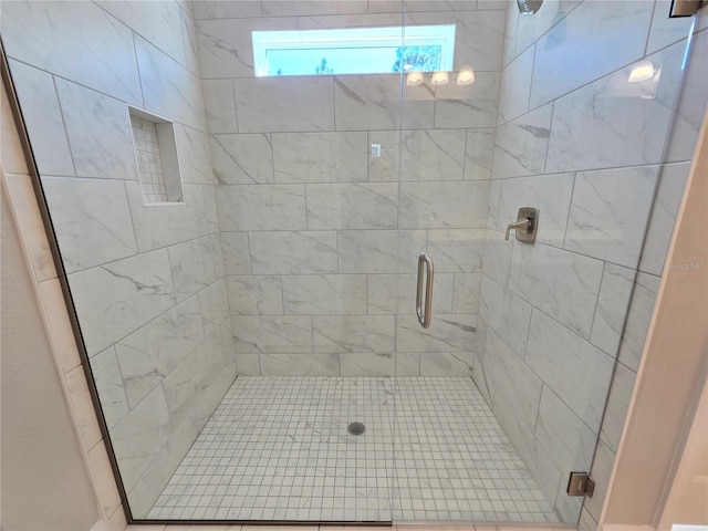 full bath with a shower stall