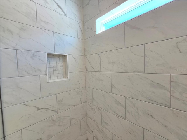 details featuring tiled shower