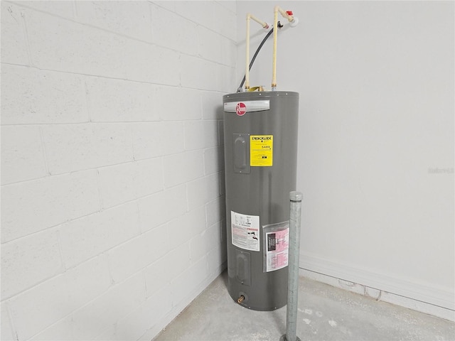 utility room featuring water heater