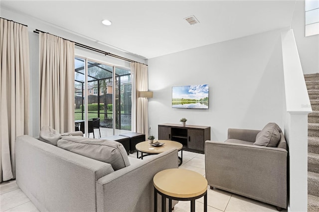 living area featuring stairway, recessed lighting, visible vents, and light tile patterned flooring