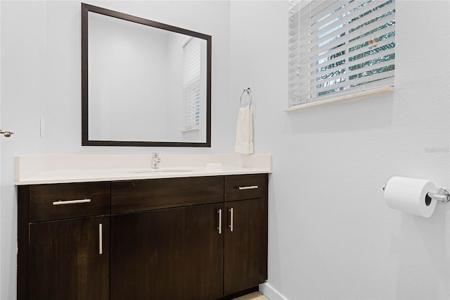 bathroom featuring vanity and baseboards