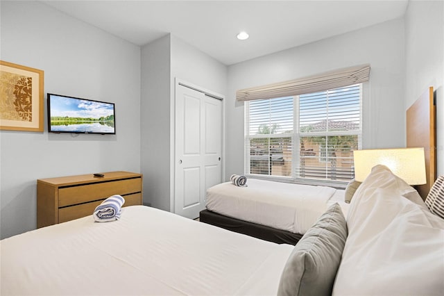 bedroom with a closet and recessed lighting