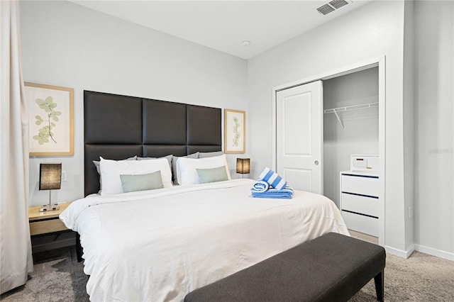 carpeted bedroom with a closet, visible vents, and baseboards