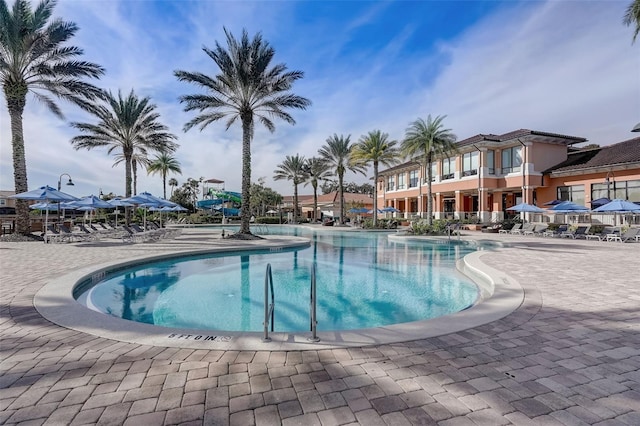 community pool with a patio area