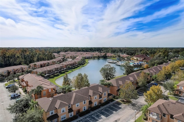 drone / aerial view with a water view and a residential view