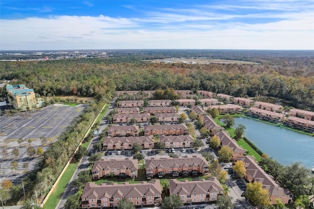 drone / aerial view featuring a water view and a residential view