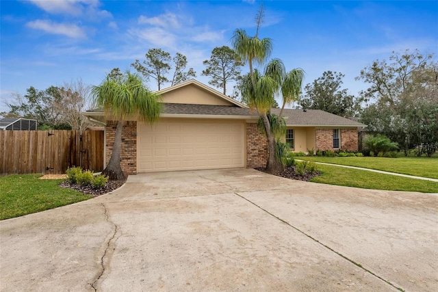 1581 Monica Joy Cir, Longwood, FL 32779 - ranch-style house featuring brick siding, concrete driveway, an attached garage, a front yard, and fence