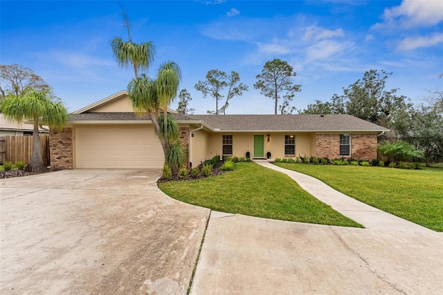 1581 Monica Joy Cir, Longwood, FL 32779 - ranch-style home featuring stucco siding, a front yard, fence, a garage, and driveway