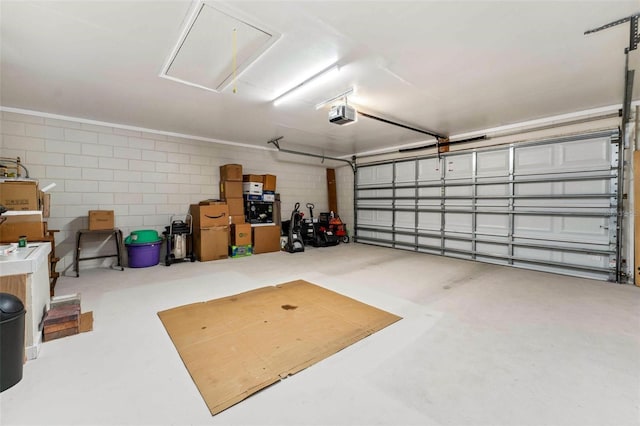 1581 Monica Joy Cir, Longwood, FL 32779 - garage with a garage door opener and concrete block wall