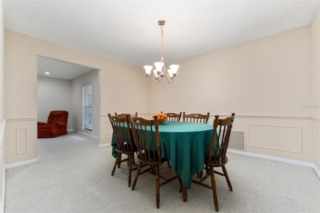 1581 Monica Joy Cir, Longwood, FL 32779 - dining space with carpet, visible vents, a decorative wall, wainscoting, and a chandelier