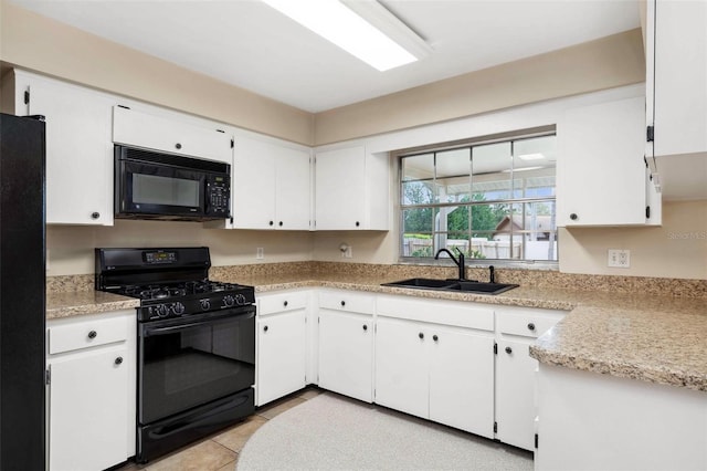 1581 Monica Joy Cir, Longwood, FL 32779 - kitchen with white cabinets, light countertops, a sink, and black appliances