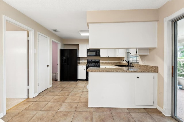 1581 Monica Joy Cir, Longwood, FL 32779 - kitchen with visible vents, white cabinetry, a sink, a peninsula, and black appliances