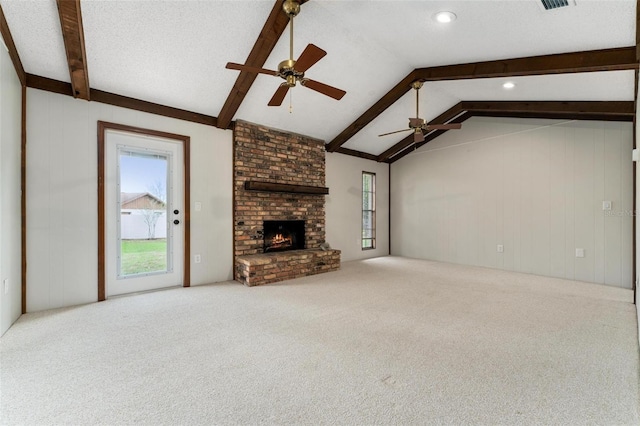 1581 Monica Joy Cir, Longwood, FL 32779 - unfurnished living room with vaulted ceiling with beams, a brick fireplace, carpet flooring, and a wealth of natural light