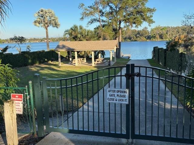 1581 Monica Joy Cir, Longwood, FL 32779 - view of gate featuring a water view and fence