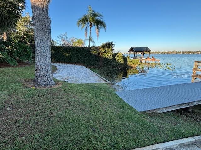 1581 Monica Joy Cir, Longwood, FL 32779 - dock area with a water view and a lawn