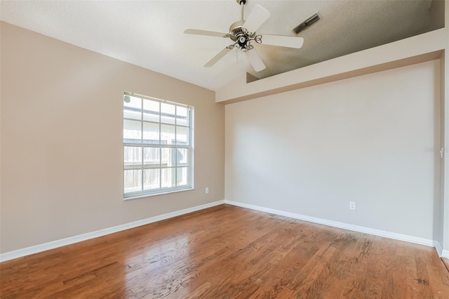 unfurnished room featuring baseboards and wood finished floors