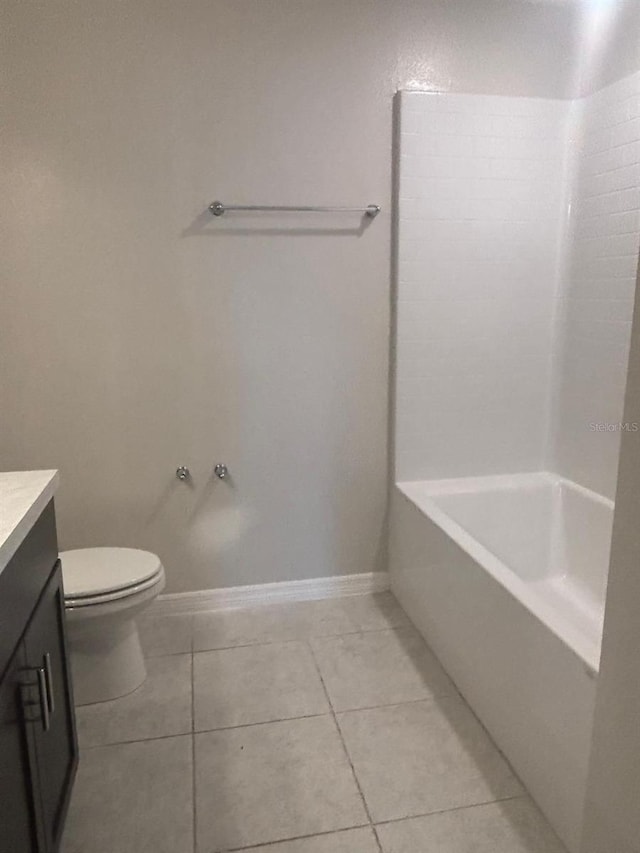 137 Willow Dr, Kissimmee, FL 34759 - bathroom with vanity, toilet, tile patterned floors, and baseboards