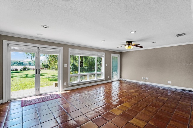 empty room with a textured ceiling, baseboards, visible vents, and crown molding