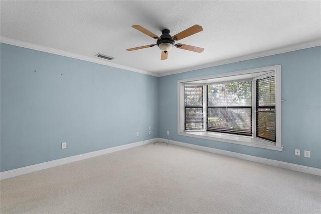 carpeted empty room with baseboards, visible vents, and ornamental molding