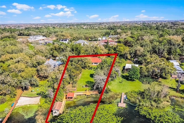 birds eye view of property with a wooded view