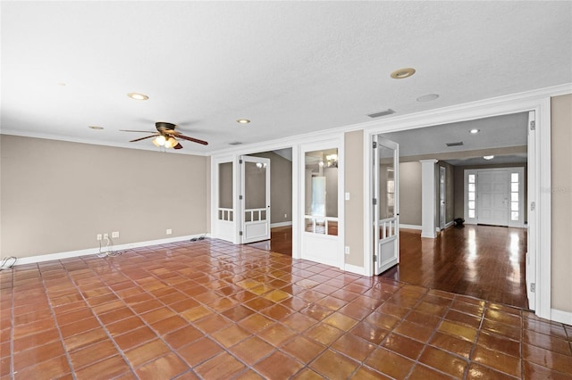 unfurnished room with visible vents, baseboards, a ceiling fan, ornamental molding, and french doors