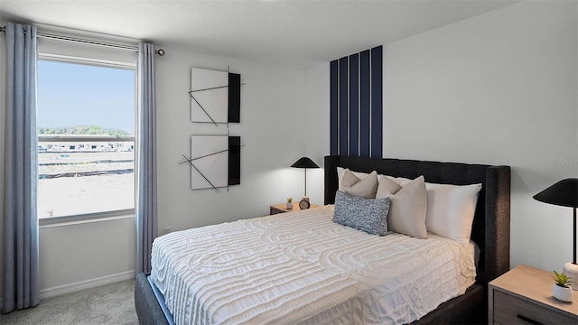 bedroom featuring carpet floors and baseboards