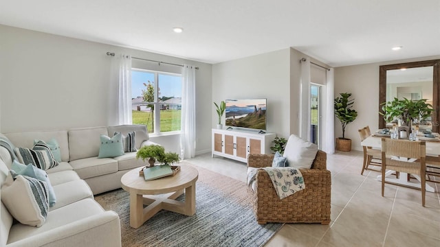 living area with light tile patterned floors and recessed lighting