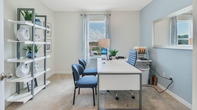 home office with carpet floors and baseboards