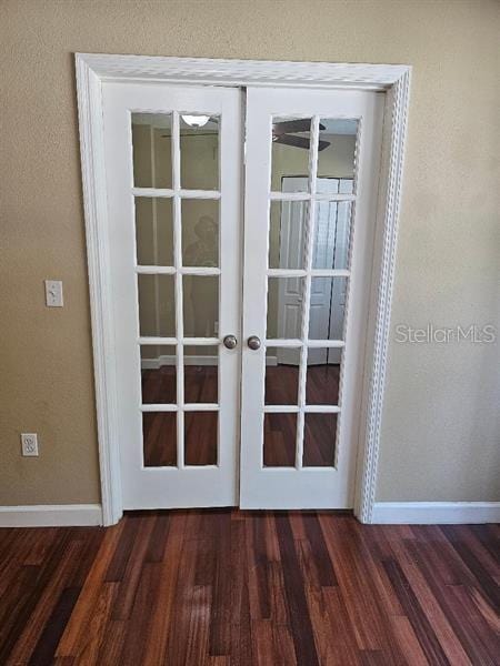 2019 Dixie Belle Dr Unit 2019O, Orlando, FL 32812 - doorway to outside with french doors, a textured wall, baseboards, and wood finished floors
