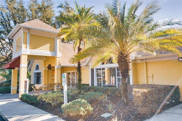 2019 Dixie Belle Dr Unit 2019O, Orlando, FL 32812 - view of front of house featuring a shingled roof and stucco siding
