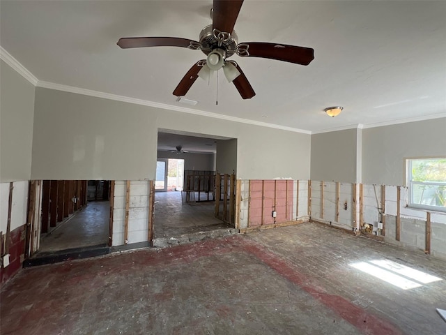 spare room with crown molding and a healthy amount of sunlight