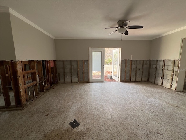 empty room with a ceiling fan and crown molding