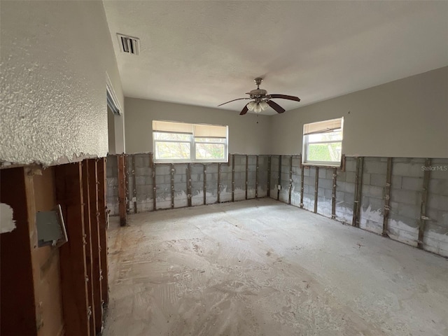 spare room featuring visible vents and a ceiling fan