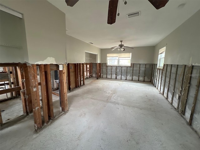 empty room featuring visible vents and a ceiling fan