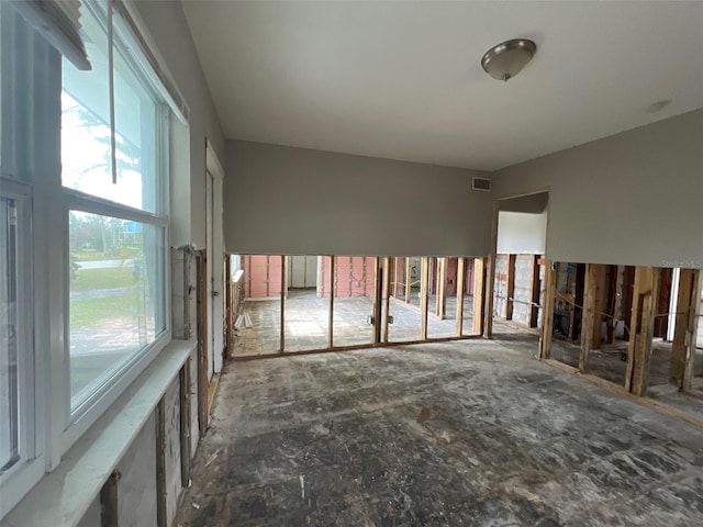 unfurnished room featuring visible vents