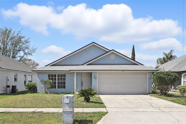 ranch-style home with driveway, a garage, roof with shingles, a front yard, and stucco siding