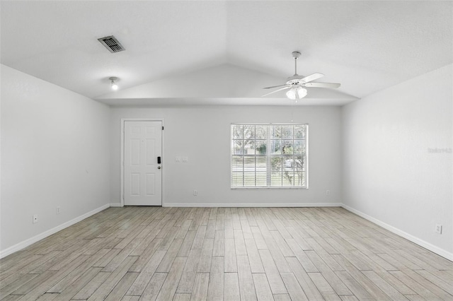 empty room with baseboards, ceiling fan, visible vents, and light wood-style floors