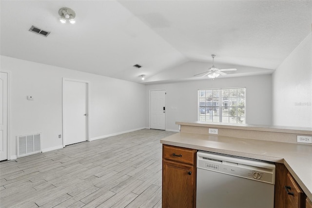 kitchen featuring lofted ceiling, open floor plan, visible vents, and dishwasher