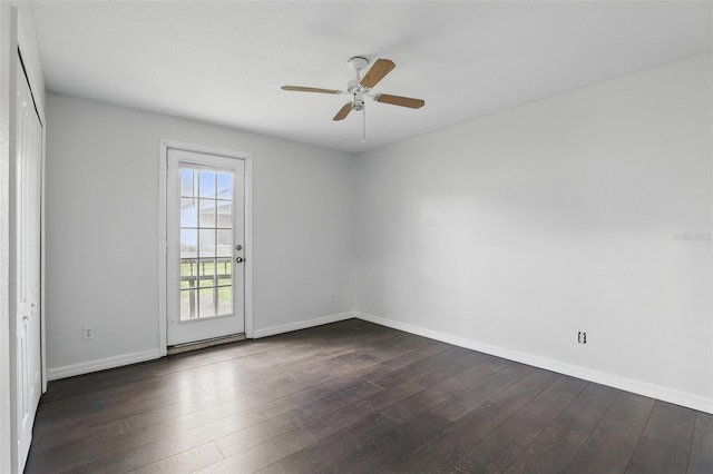 unfurnished room with ceiling fan, baseboards, and dark wood-style flooring