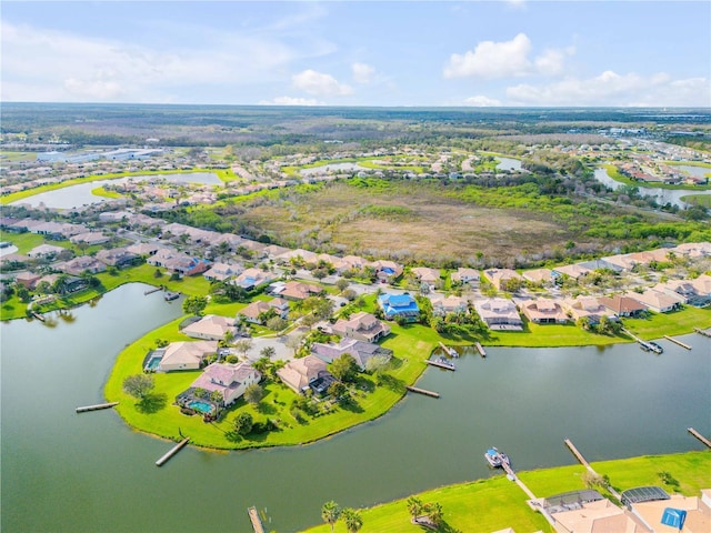 aerial view featuring a water view and a residential view