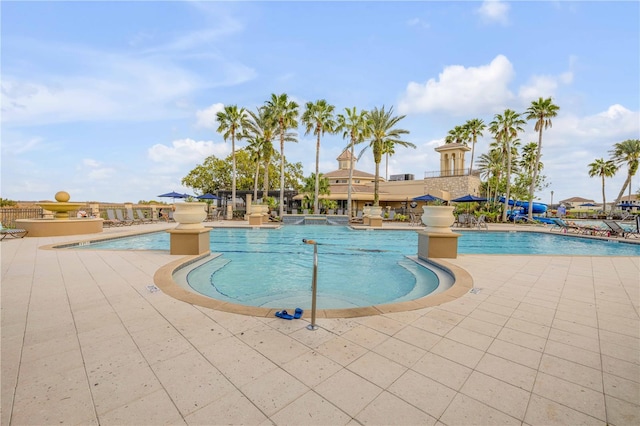 community pool with a patio