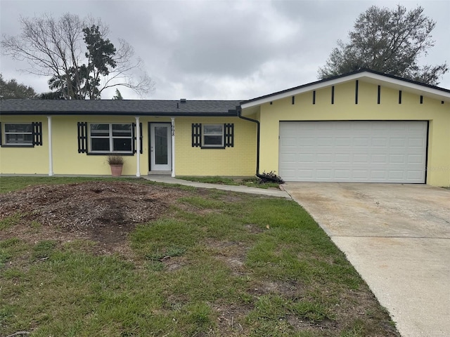 single story home with a garage, driveway, and brick siding