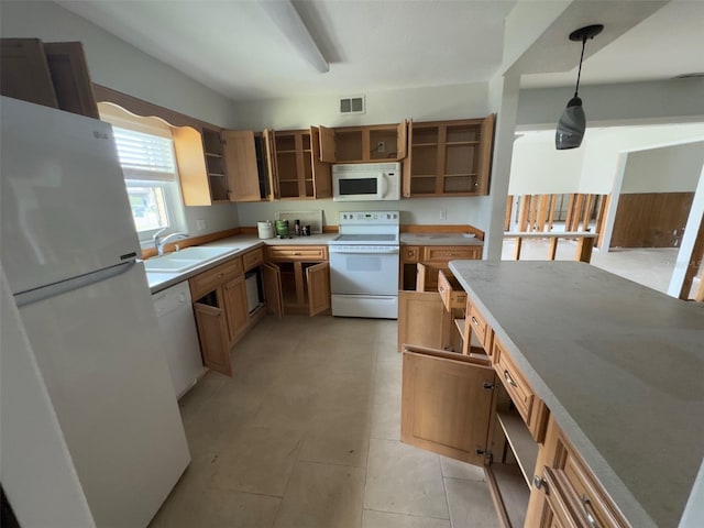 kitchen featuring open shelves, visible vents, hanging light fixtures, a sink, and white appliances